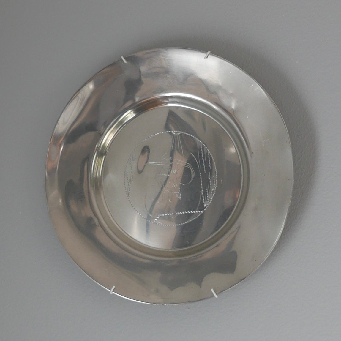 Pewter wall plate, 1931