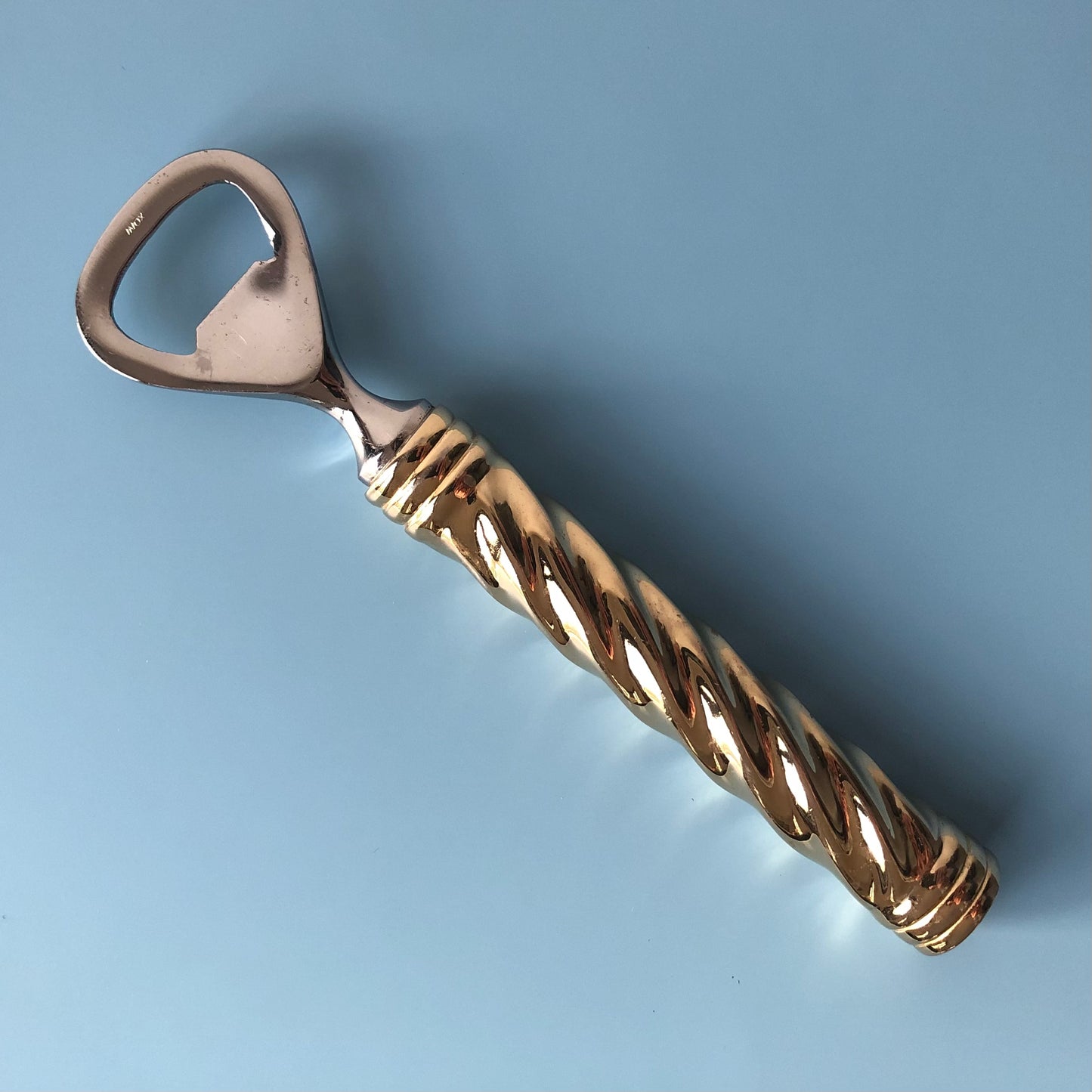 Gilded bottle opener