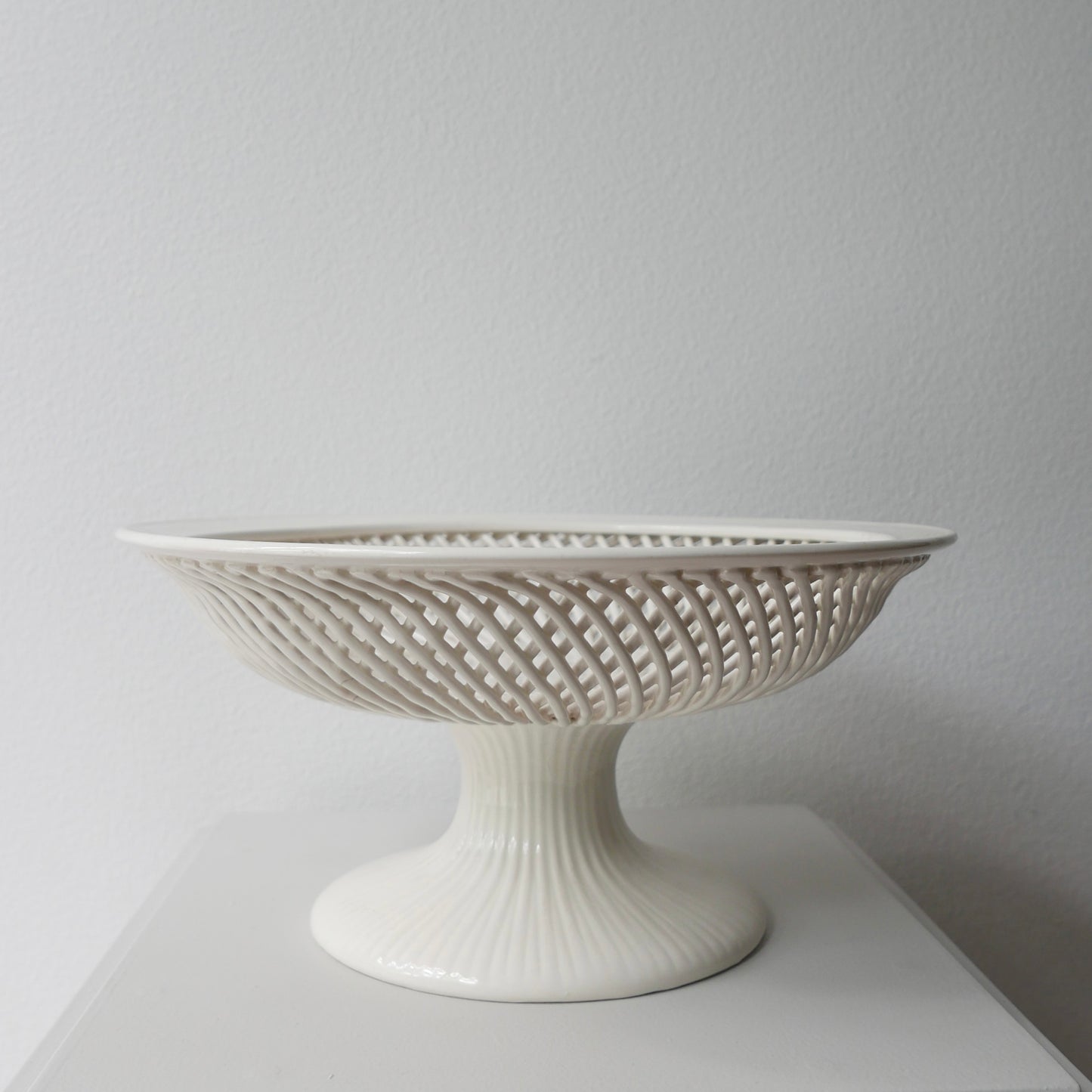 Footed woven porcelain fruit bowl