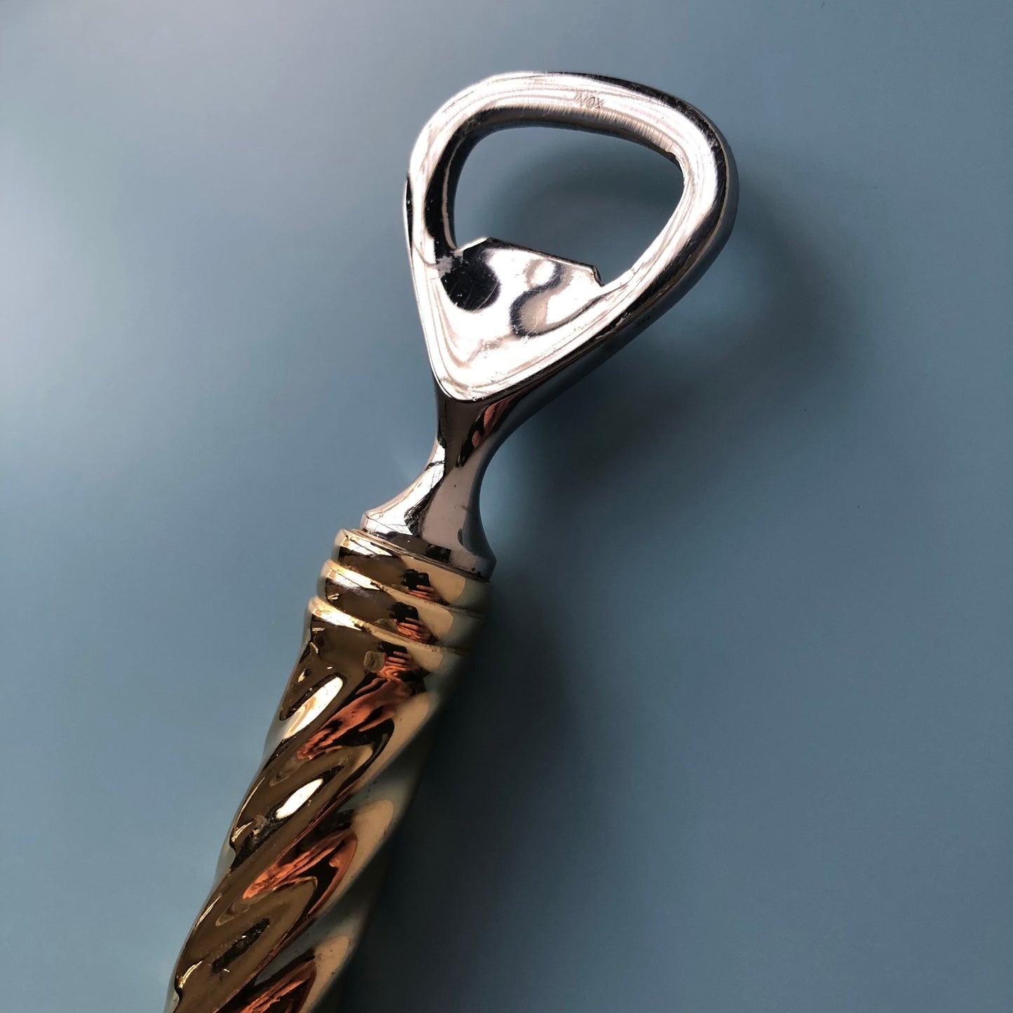 Gilded bottle opener